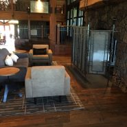 Hardwood flooring shown in front of stone fireplace at Sunriver Resort