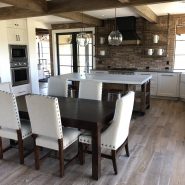 Reclaimed-style engineered wood flooring in dining room.