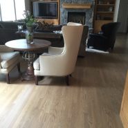 Select grade white oak flooring in sitting room with armchairs
